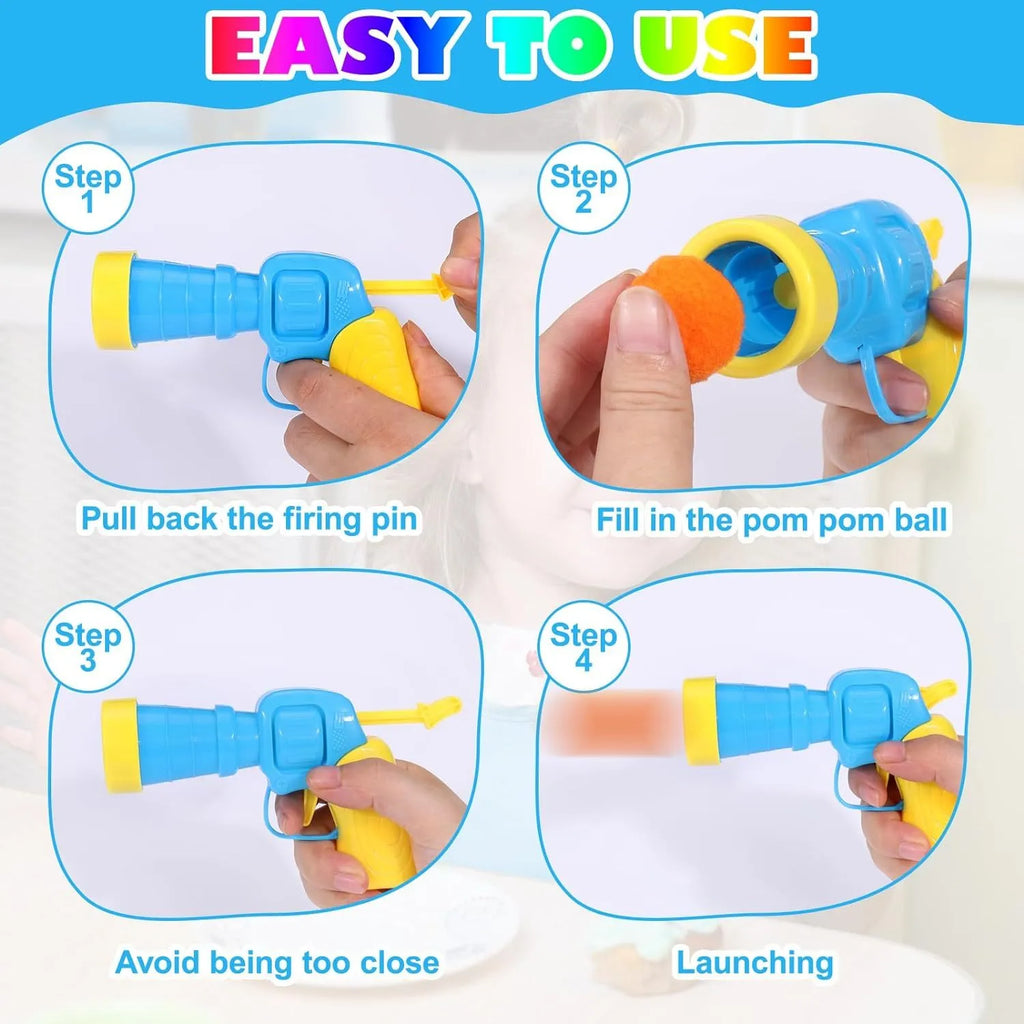 Cat toy ball launcher gun in hand with 20 soft plush pom pom balls for interactive fetch play