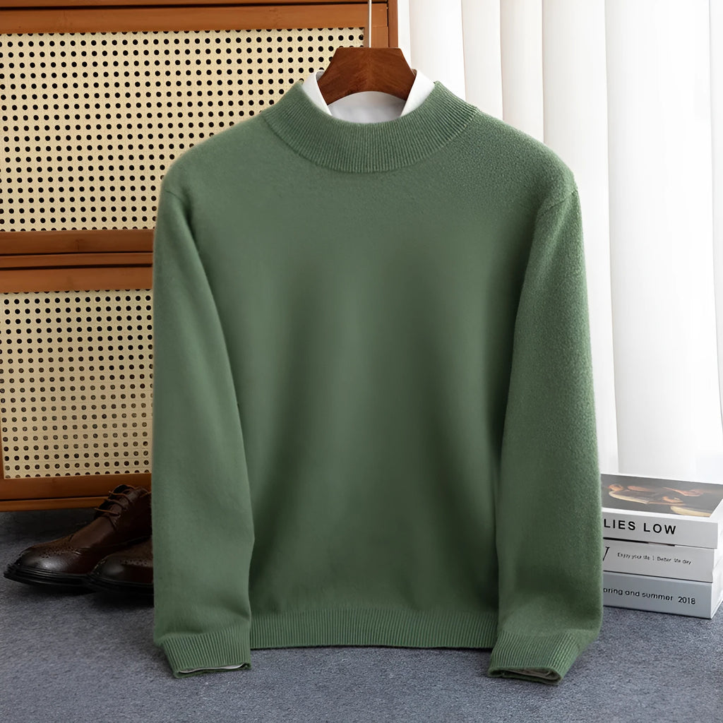 Man wearing a half-collar loose wool sweater in a textured rough yarn knit.