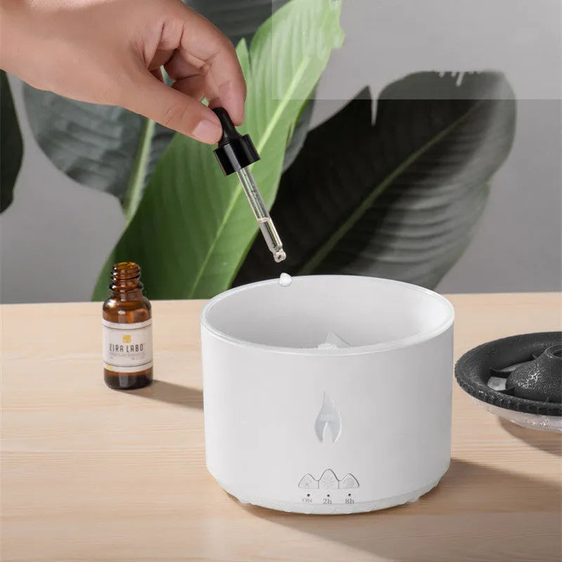 Round two-colour flame spray mist humidifier and aromatherapy diffuser on a table.