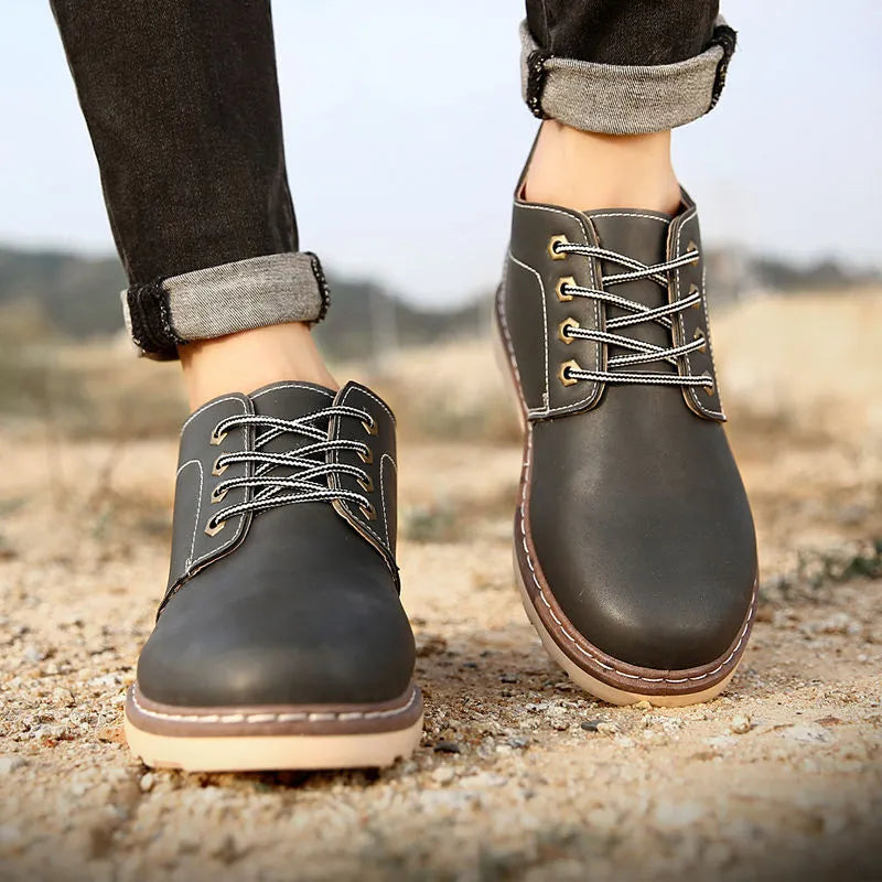 Men's black mid-top British leather style boots with waterproof uppers and rubber soles