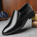 Men's black business casual slip-on shoes with leather toe cap and rubber sole