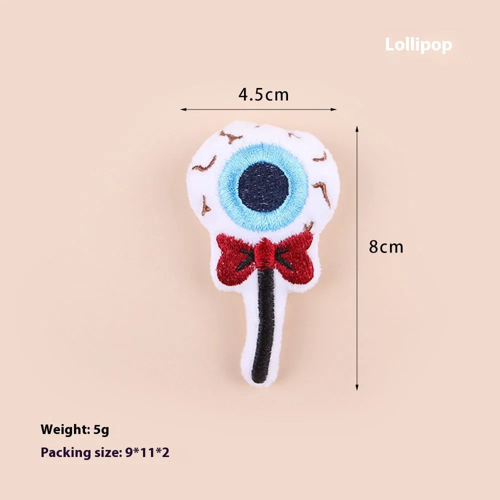 Small cat teaser wand with a soft plush head in eyes, candy, or skull design