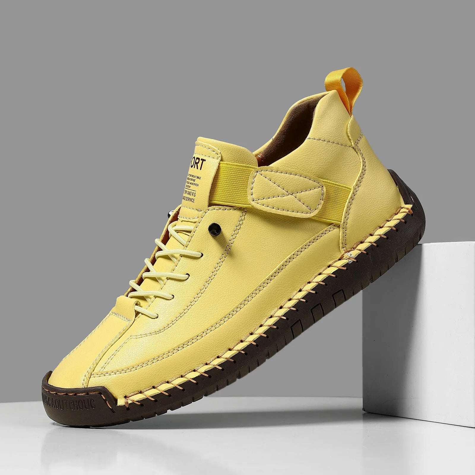 Men's mid-calf black Martin boots with tooling stitching and a flat rubber sole on a white background.