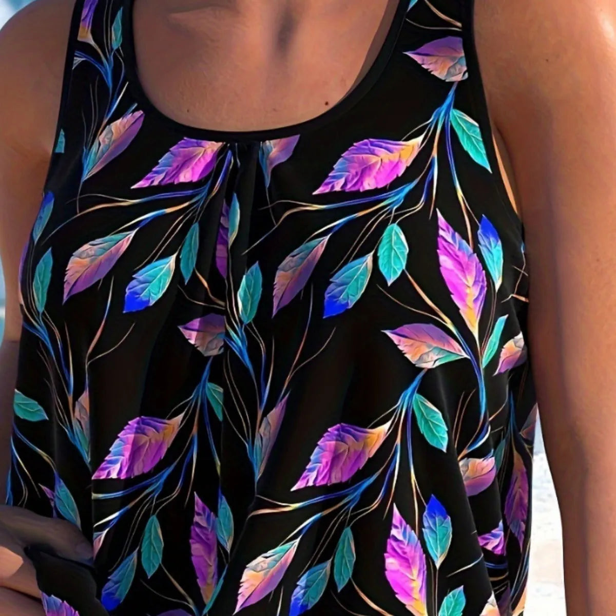 Women's leaf print two-piece swimsuit with top and shorts in pure colour on mannequin