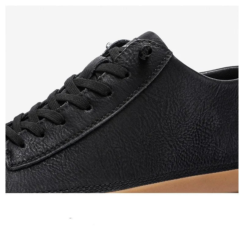 Men's black leather casual shoes with round toe and flat rubber sole, shown with lace-up closure.