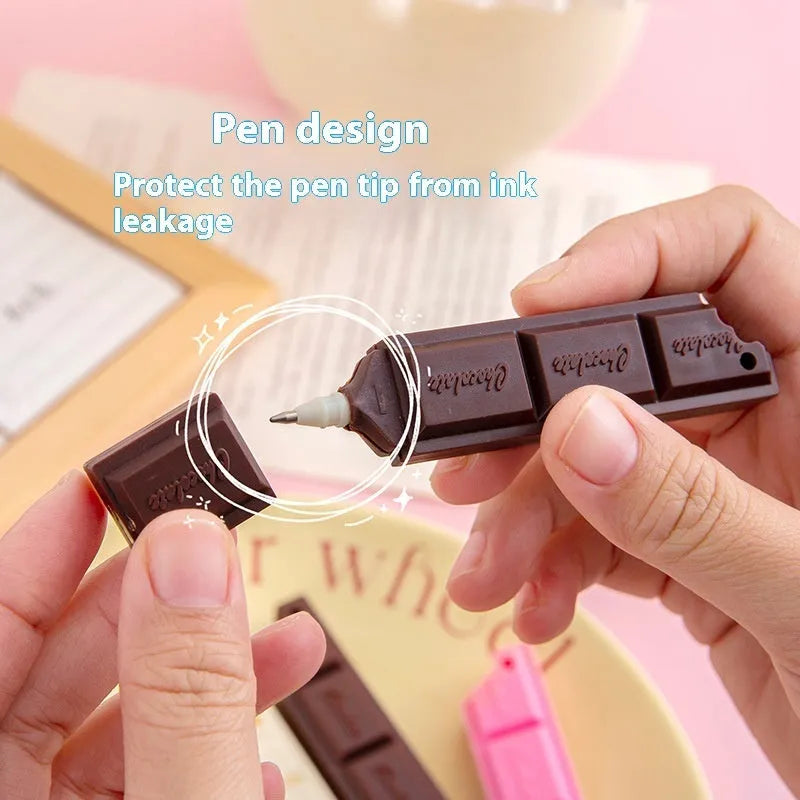 Chocolate ballpoint pen with cartoon food design in pink, beige, and brown colours
