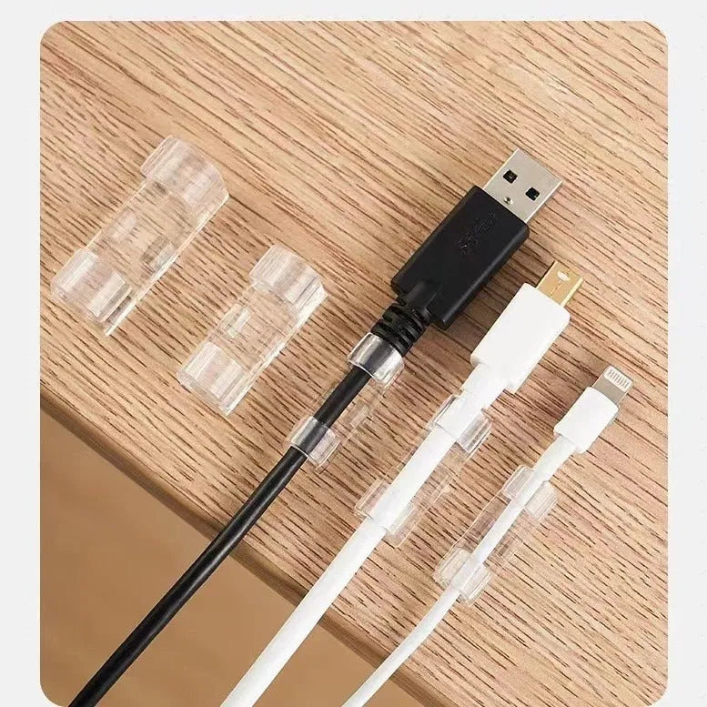 Transparent plastic self-adhesive wire routing clips for cable organisation