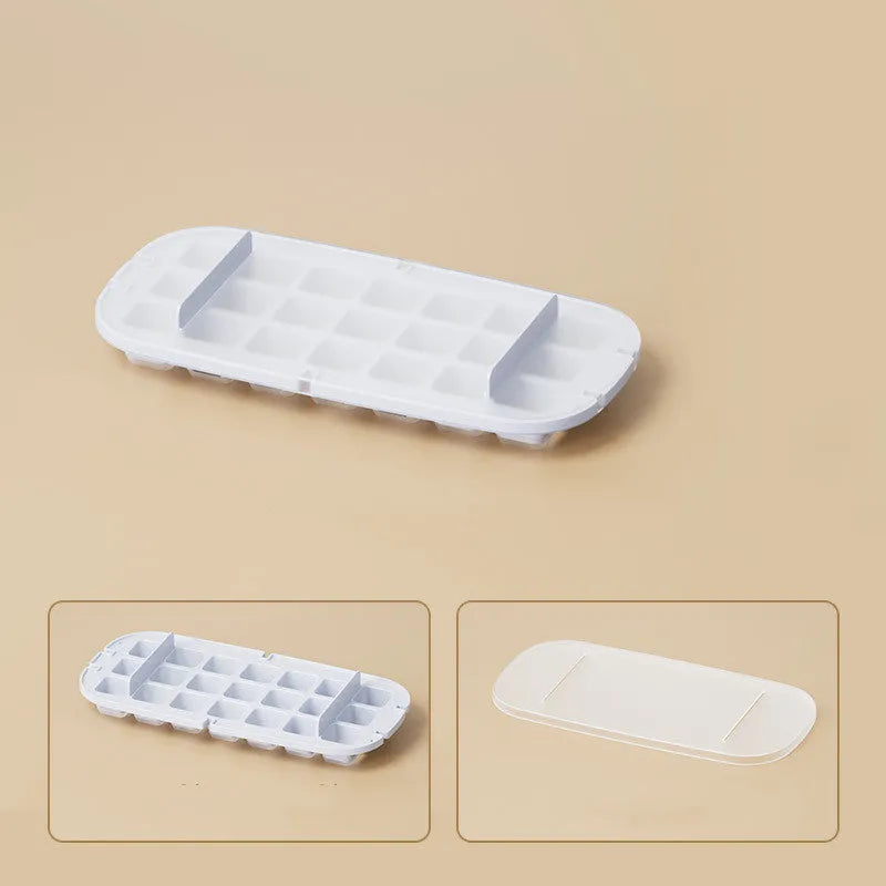 Yellow high-capacity ice cube tray with grid design and a storage slot for an ice shovel.