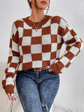 Dark brown plaid pattern loose fit pullover sweater with long sleeves and a round neck.