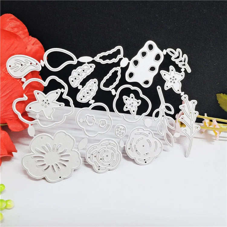 Silver carbon steel craft die with etched flower design for paper cutting, measuring 14.3 by 9.9 cm.