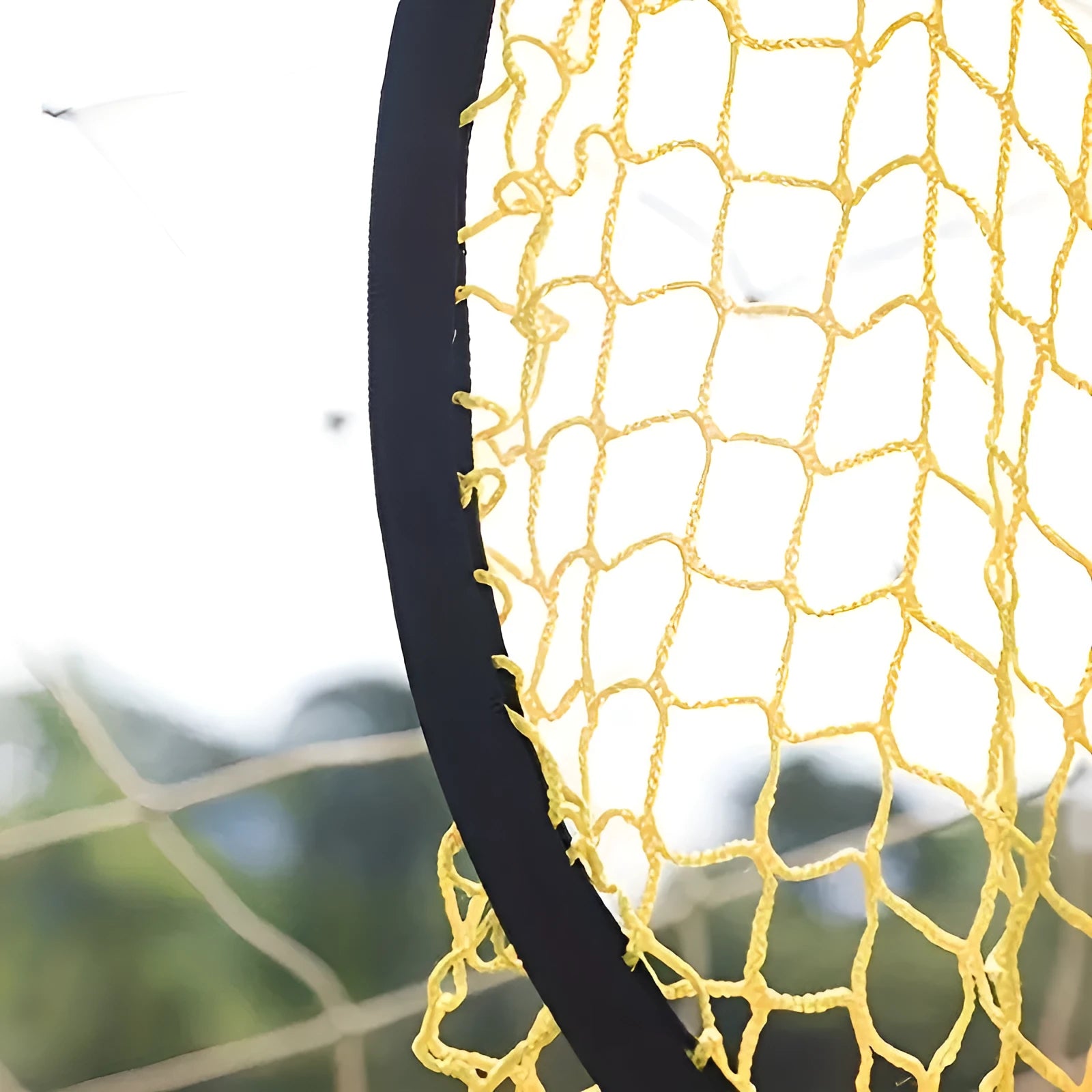 Black portable soccer training goal net set up on grass, showing 130cm square frame and netting.