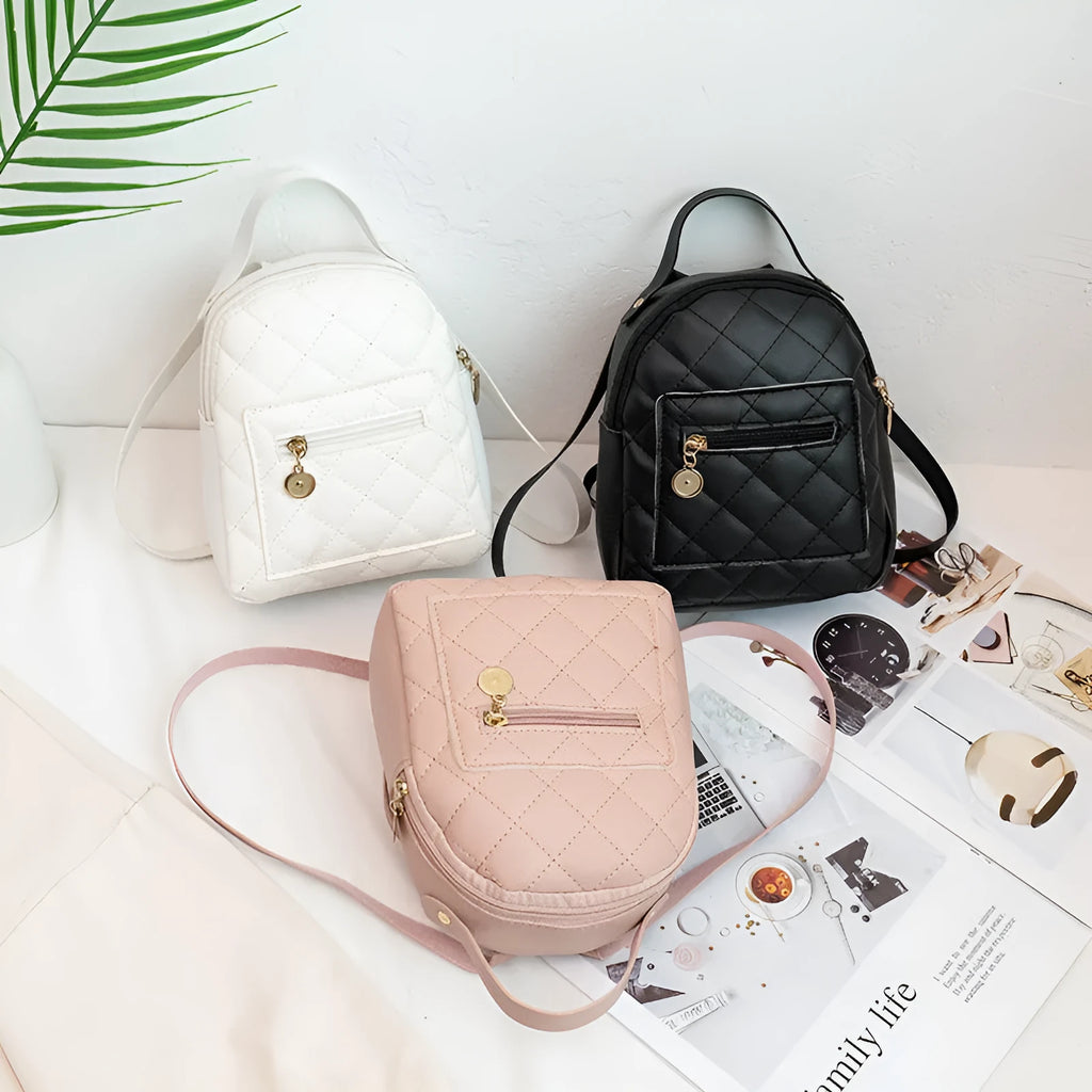 Girls' hard case Korean-style embroidered backpack in pink showing vertical square shape and soft carry handle.