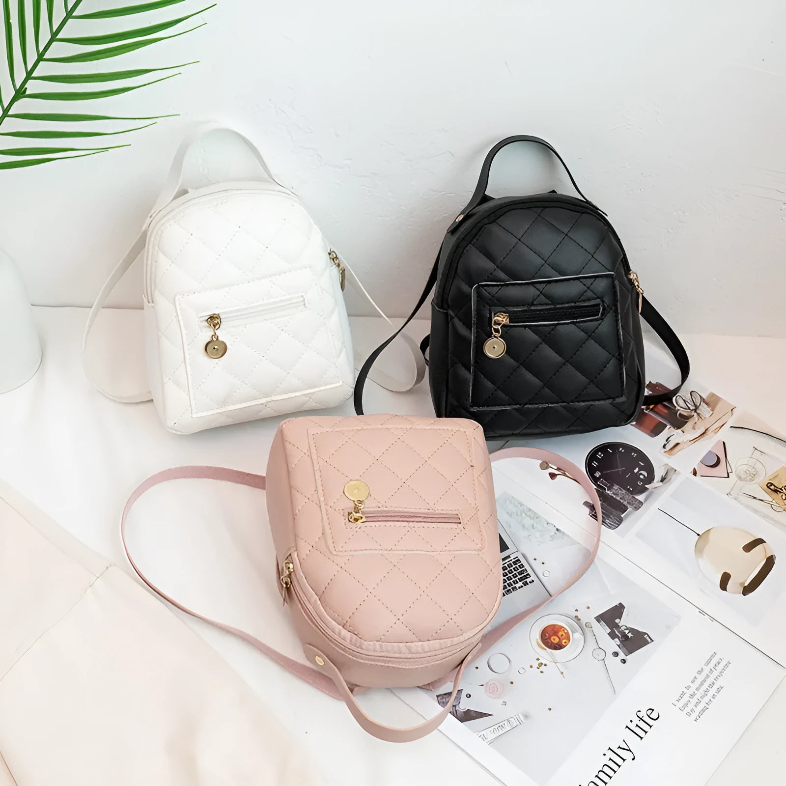 Girls' hard case Korean-style embroidered backpack in pink showing vertical square shape and soft carry handle.