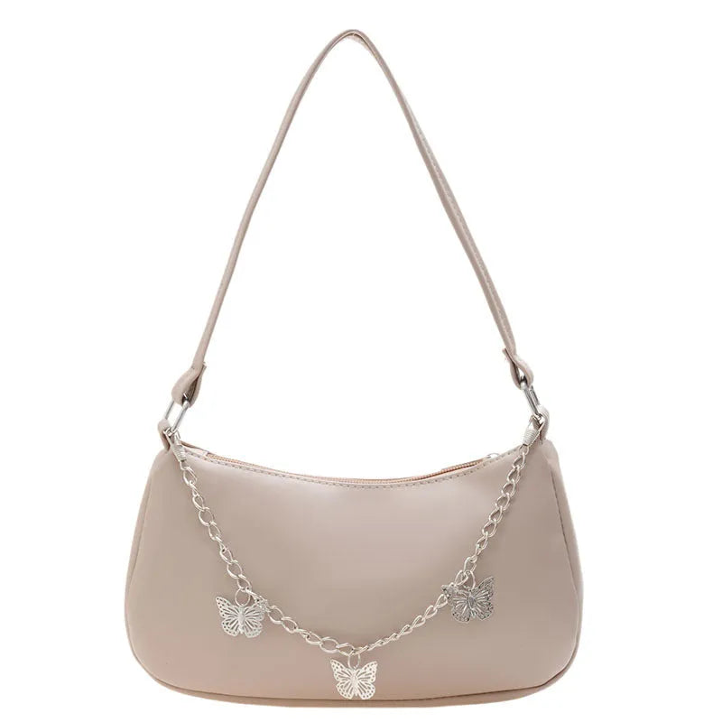 Square black PU leather crossbody bag with a butterfly chain strap and external structured pocket.