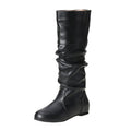 Women's black flat slip-on boots with round toe and high ankle shaft.