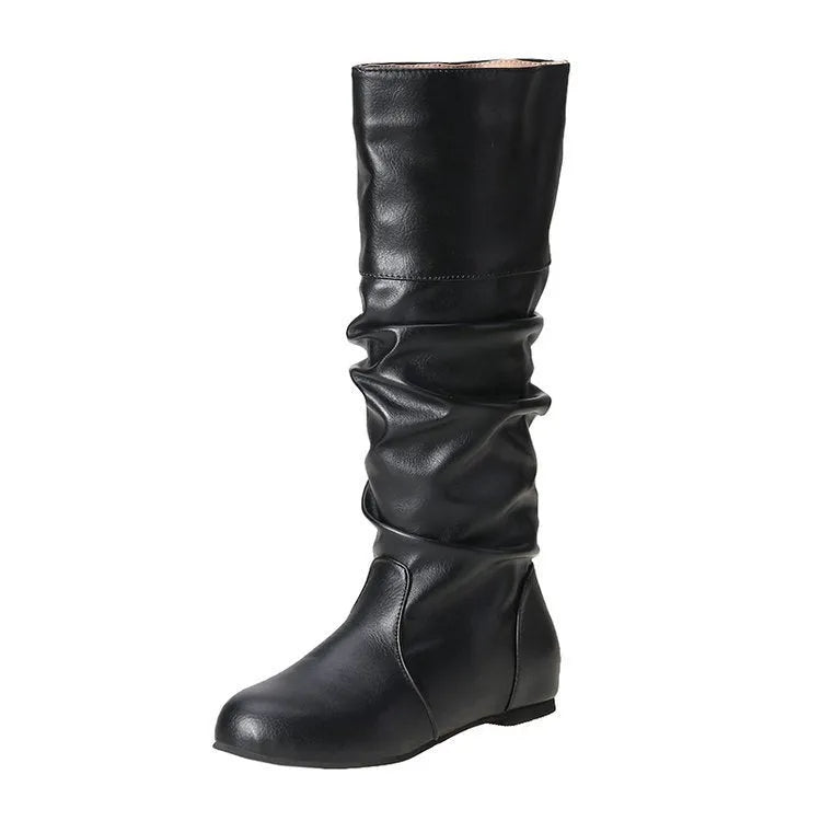 Women's black flat slip-on boots with round toe and high ankle shaft.