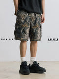 Loose straight-leg denim shorts in army green with a zip fly and elasticated mid-waist.