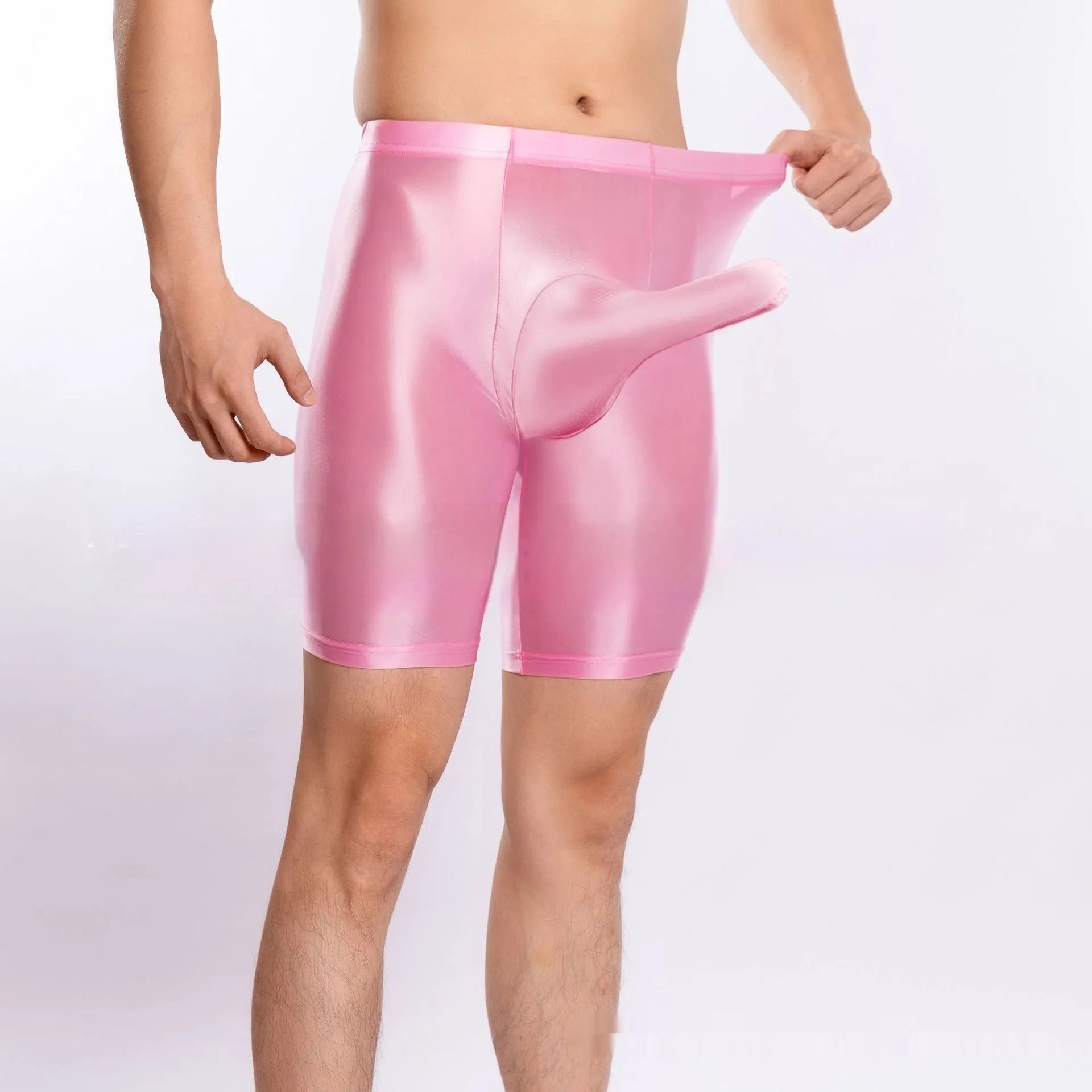 Man wearing shiny black plus size nylon sports shorts, showing silky finish.