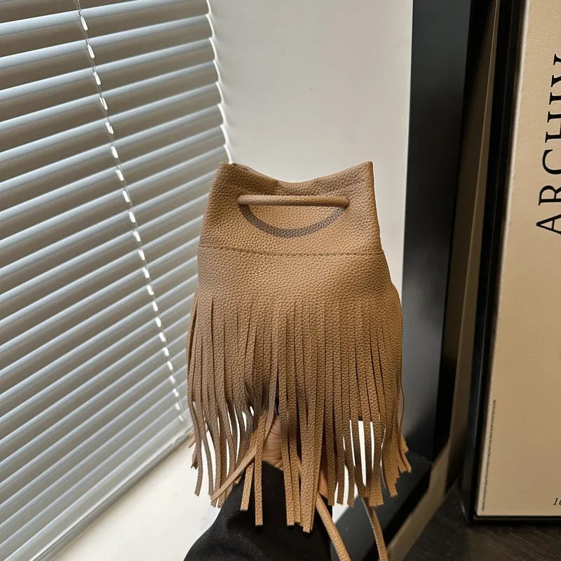 Women's soft leather tassel small satchel in bucket shape with open pocket, five colour options