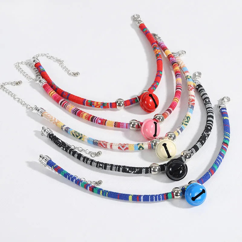 Ethnic style pet collar with bell necklace in five colours including black, blue, pink, red, and white