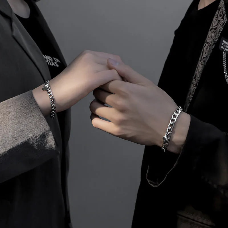 Silver magnetic couple bracelet with heart charm on stainless steel chain