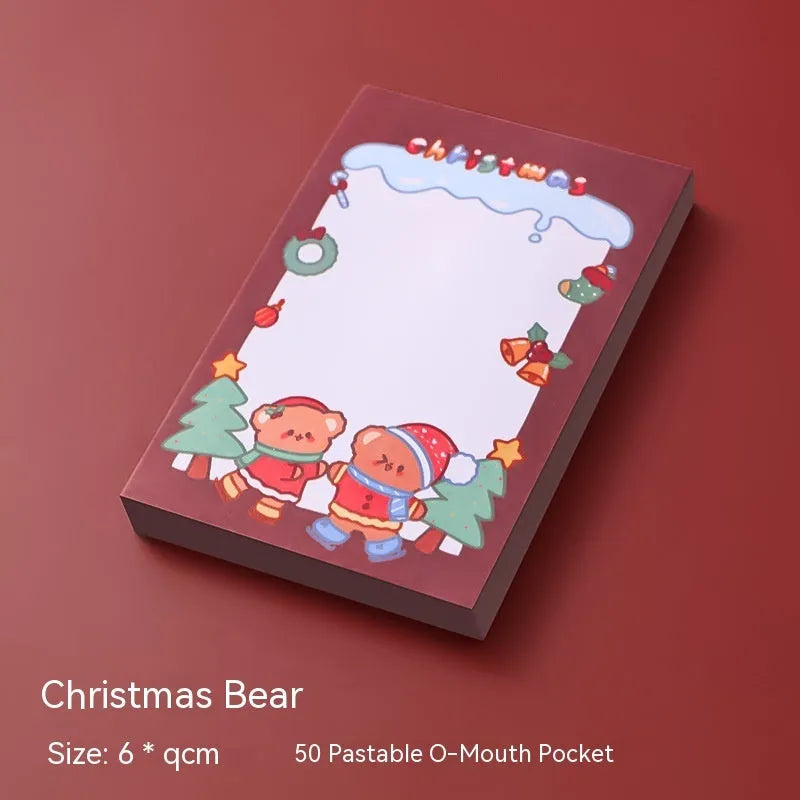 Christmas sticky notes pad showing eight festive designs including Santa Claus, elf, snowman, and gift box
