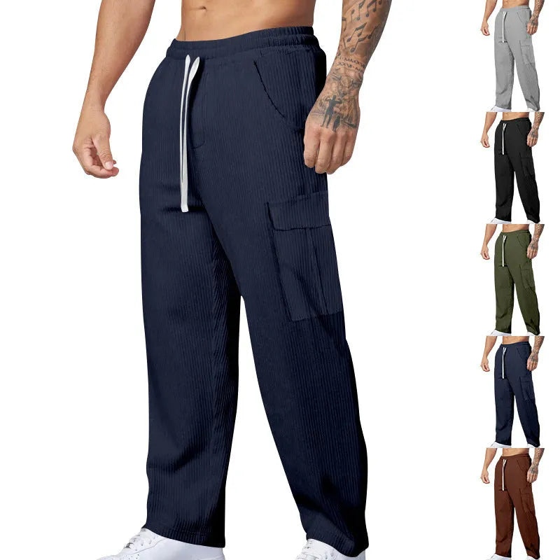 Men's loose-fitting corduroy cargo trousers in navy blue with straight wide-leg cut and elasticated waist