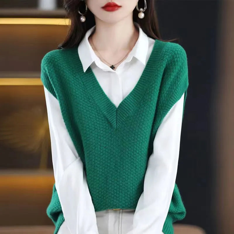 Creamy-white V-neck sleeveless knitted vest with a raised 3D pattern, laid flat.
