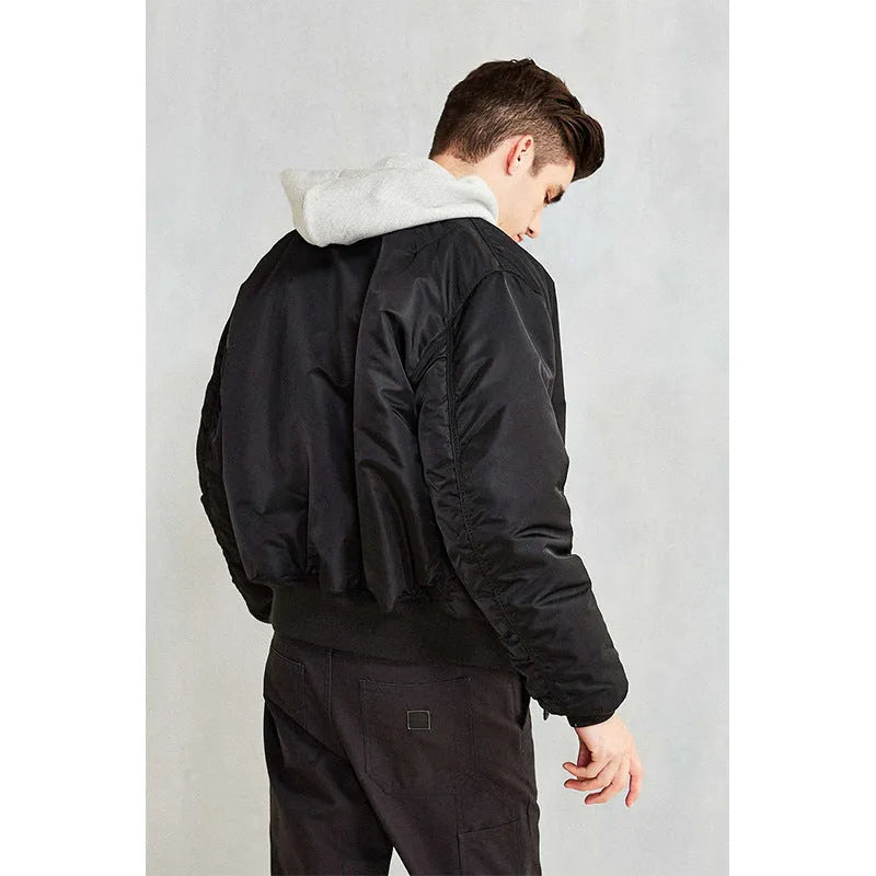 Men's loose fit cotton-padded nylon pilot jacket in army green on a hanger.