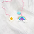 Handmade crocheted avocado rainbow flower car pendant in wool with cartoon styling
