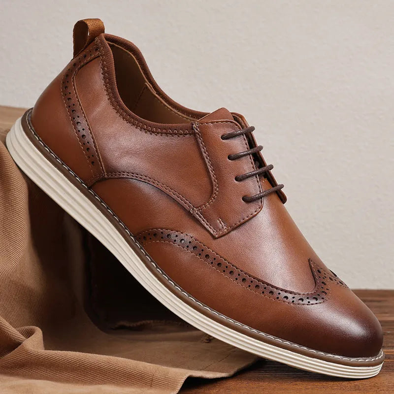 Men's black slip-on casual shoe with round toe and carved detail on the PU upper.