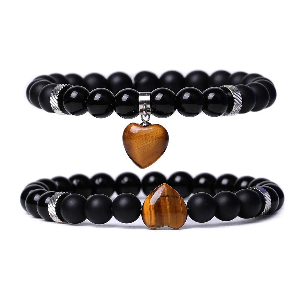 Natural stone couple bracelet set showing two matching bracelets with heart-shaped polished stone charms