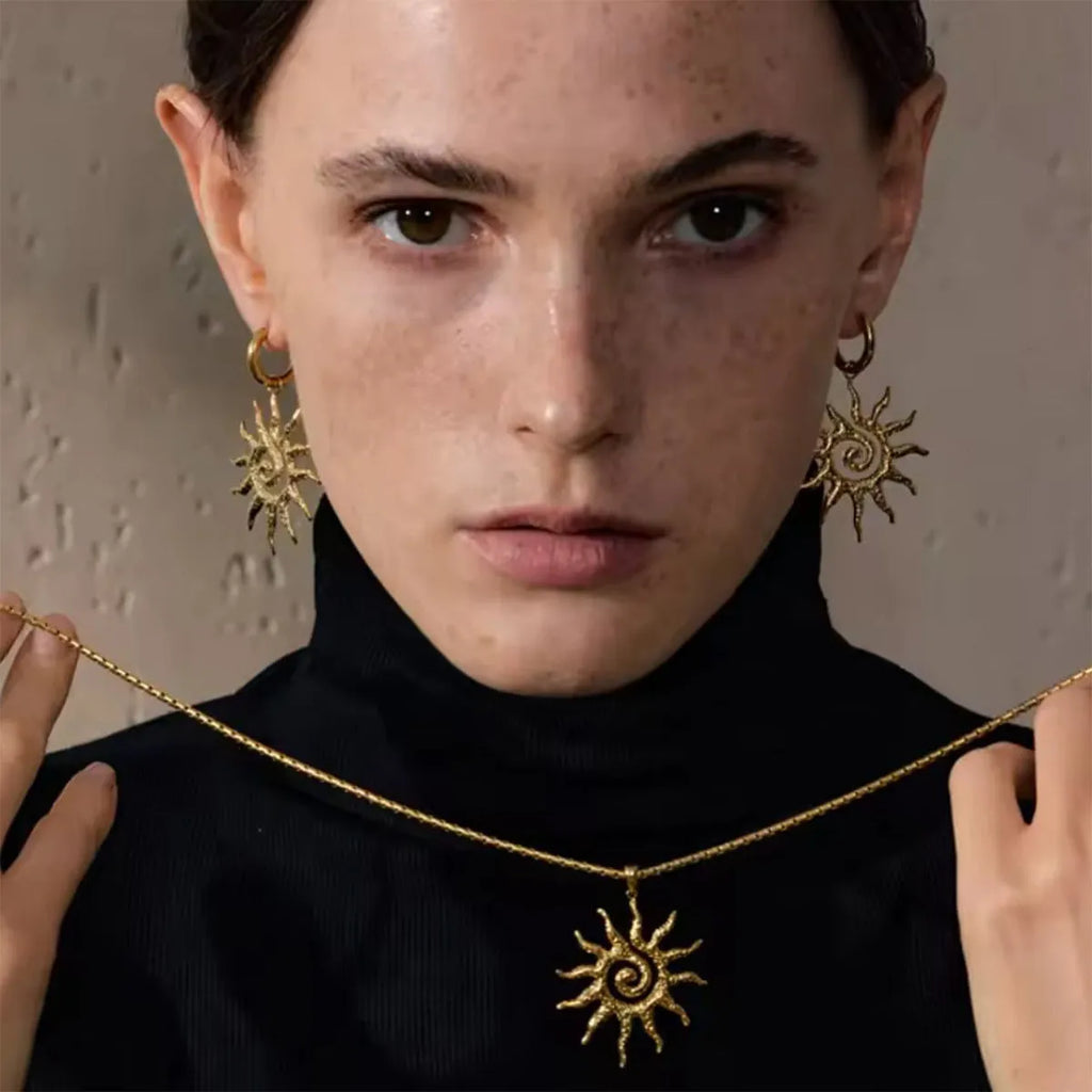 Gold sun hollow pendant necklace on regular chain with matching earrings and ring in zinc alloy electroplated finish