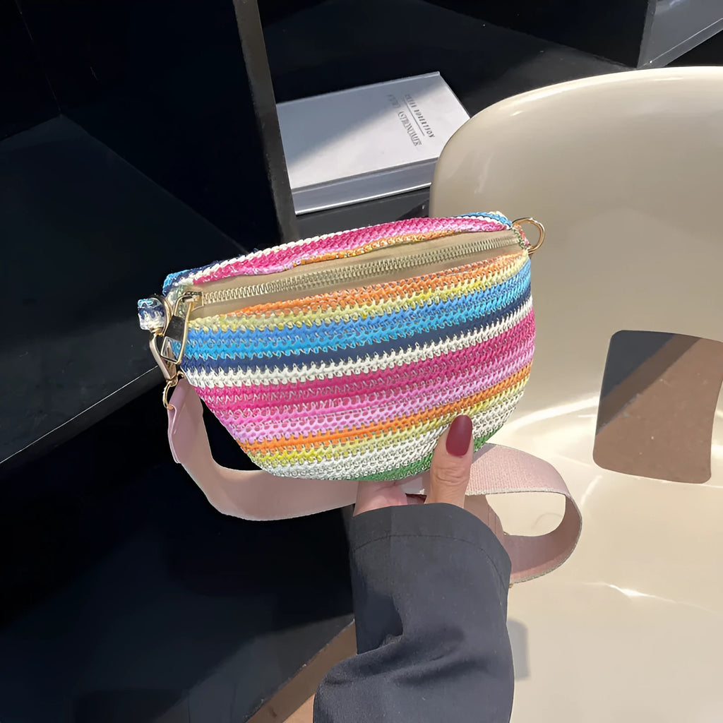 Bohemian style straw beach bag with woven construction, shell shape, and single shoulder strap