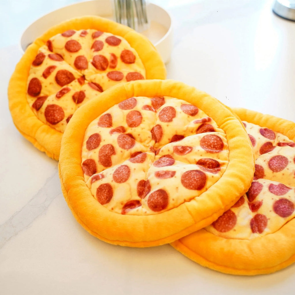 Yellow pizza slice shaped soft fabric dog chew toy with internal squeaker.