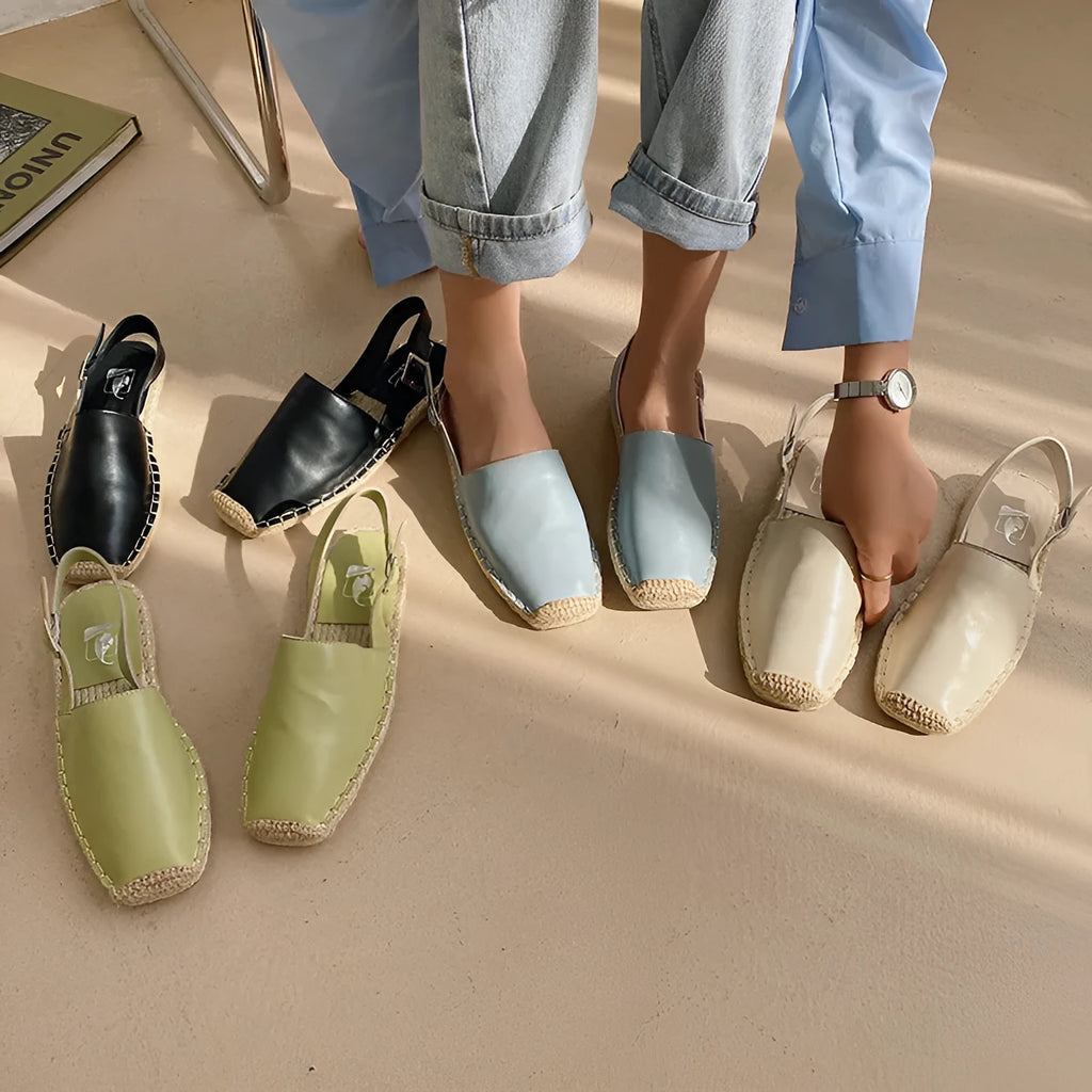 Women's retro-style flat sandals in canvas with an animal pattern, shown in multiple colours.