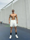 Men's ice silk quick-drying double-layer casual shorts in nylon fabric on a colour swatch background.