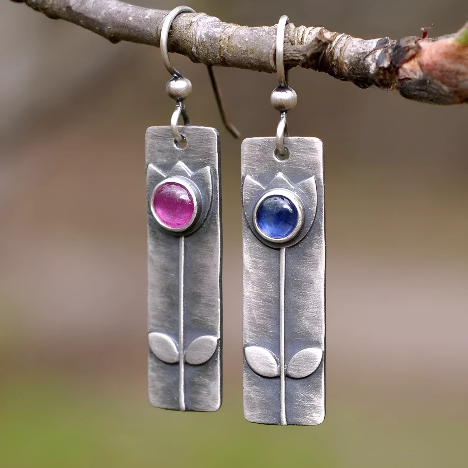 Geometric red sapphire earrings for women with an antique finish and ellipse details.