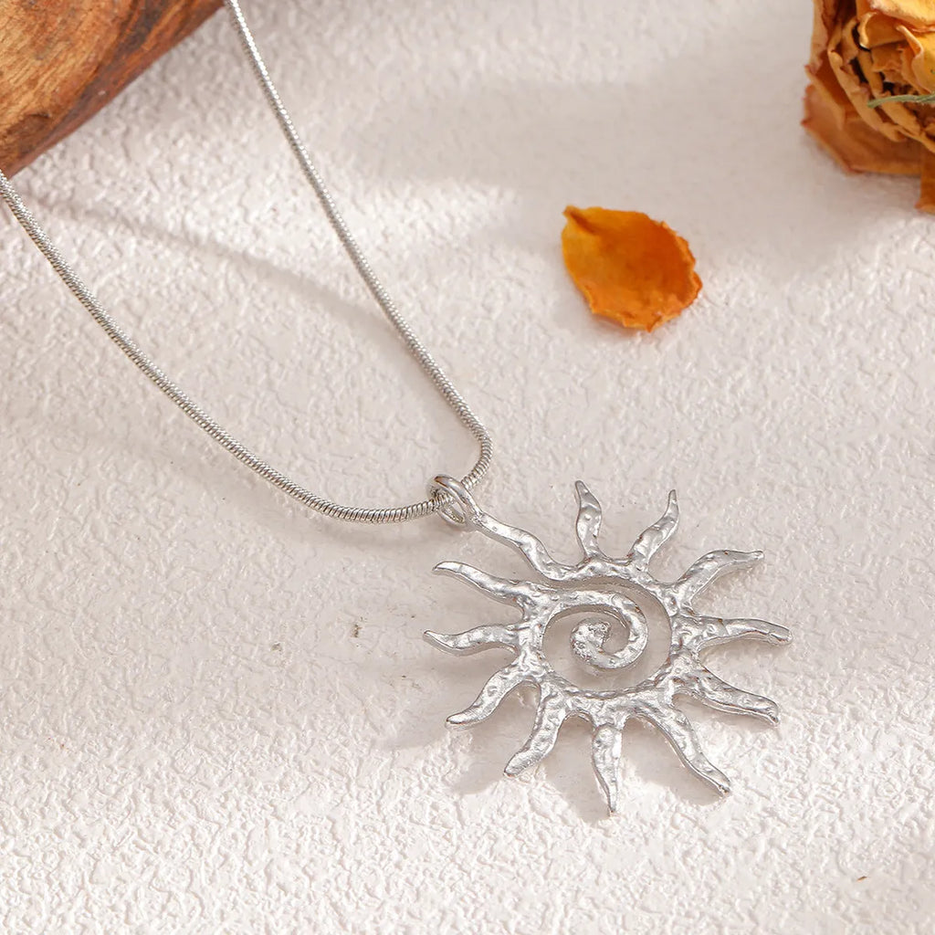 Gold sun hollow pendant necklace on regular chain with matching earrings and ring in zinc alloy electroplated finish