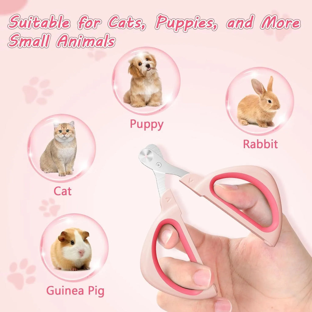 Close-up of a pink pet nail clipper showing the round positioning hole and stainless steel blade.