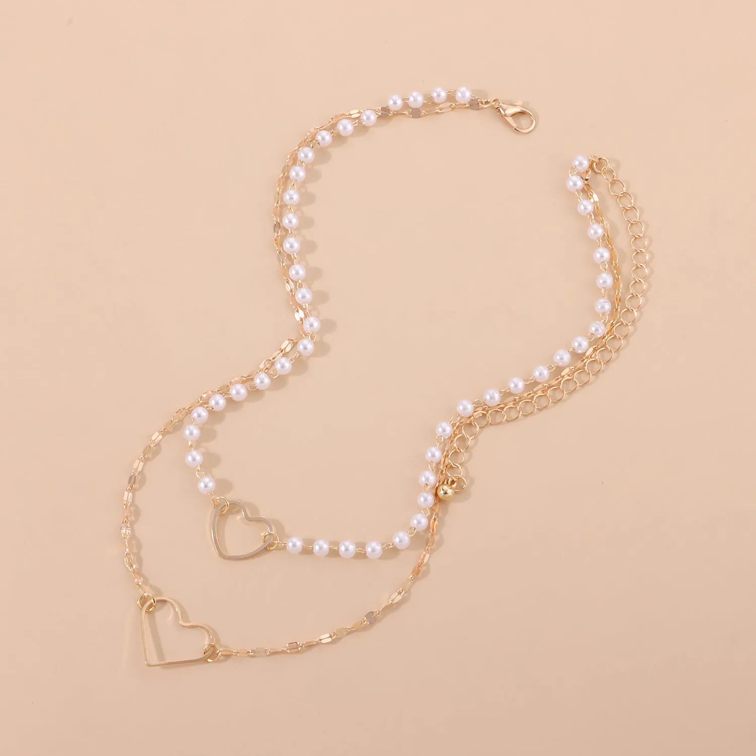 Gold heart-shaped zinc alloy pendant necklace on adjustable chain