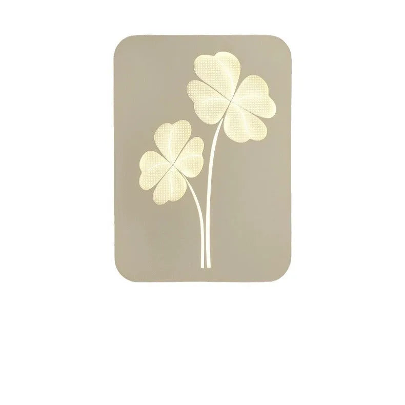 Modern bedside lamp with an acrylic shade showing a love heart motif and three-colour LED light.