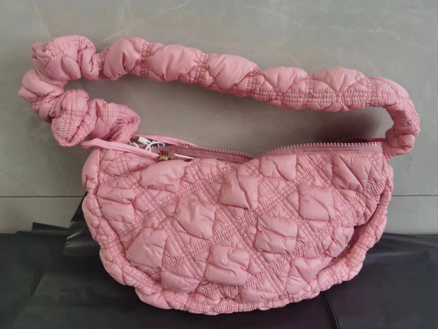 Women's nylon shoulder messenger bag in a solid colour with a long strap, showing front view.