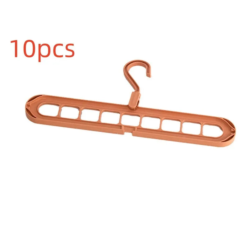 Green plastic nine-hole hanger folded flat showing multiple trouser hanging points