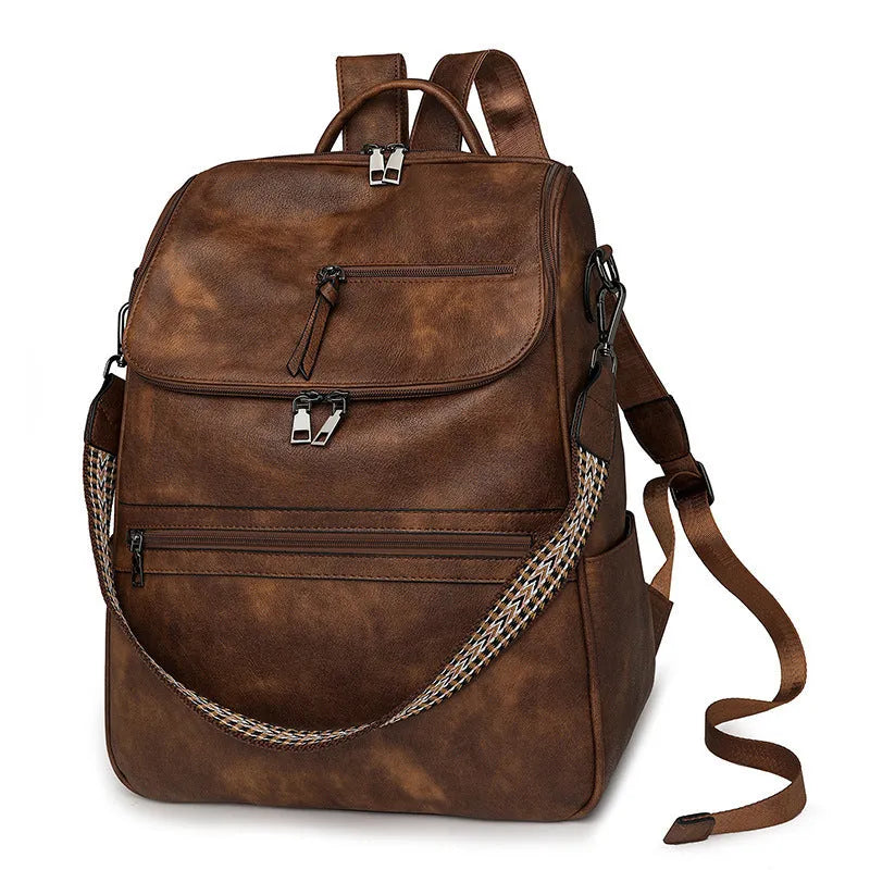 Solid colour retro college backpack with curved shoulder straps, shown in multiple colour options including black and blue.