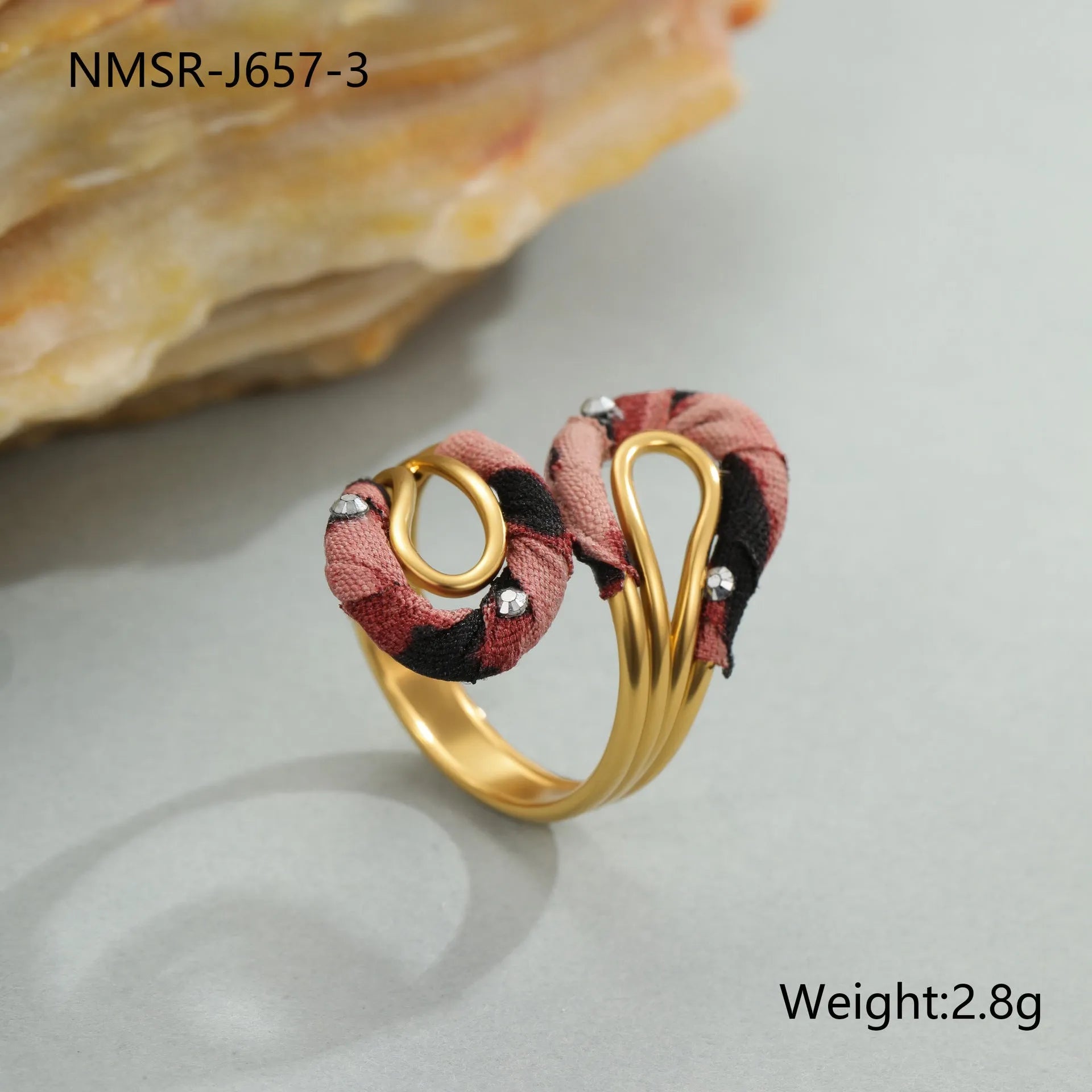 Stainless steel open mouth ring with leopard print in geometric shape on a hand.