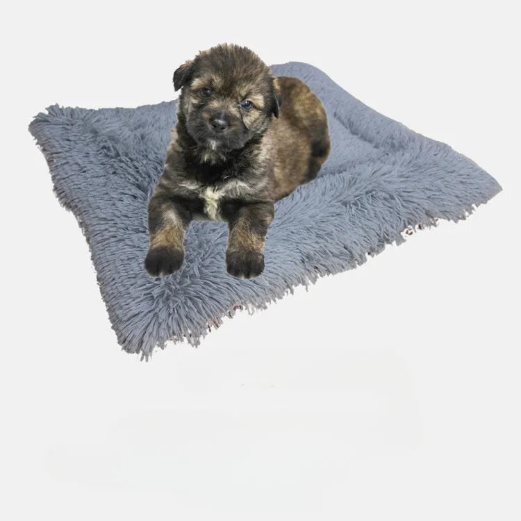 Grey pet blanket with long plush hair and black non-slip bottom particles