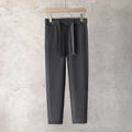 Boys slim straight wool trousers with tapered fit and straight leg opening in black colour