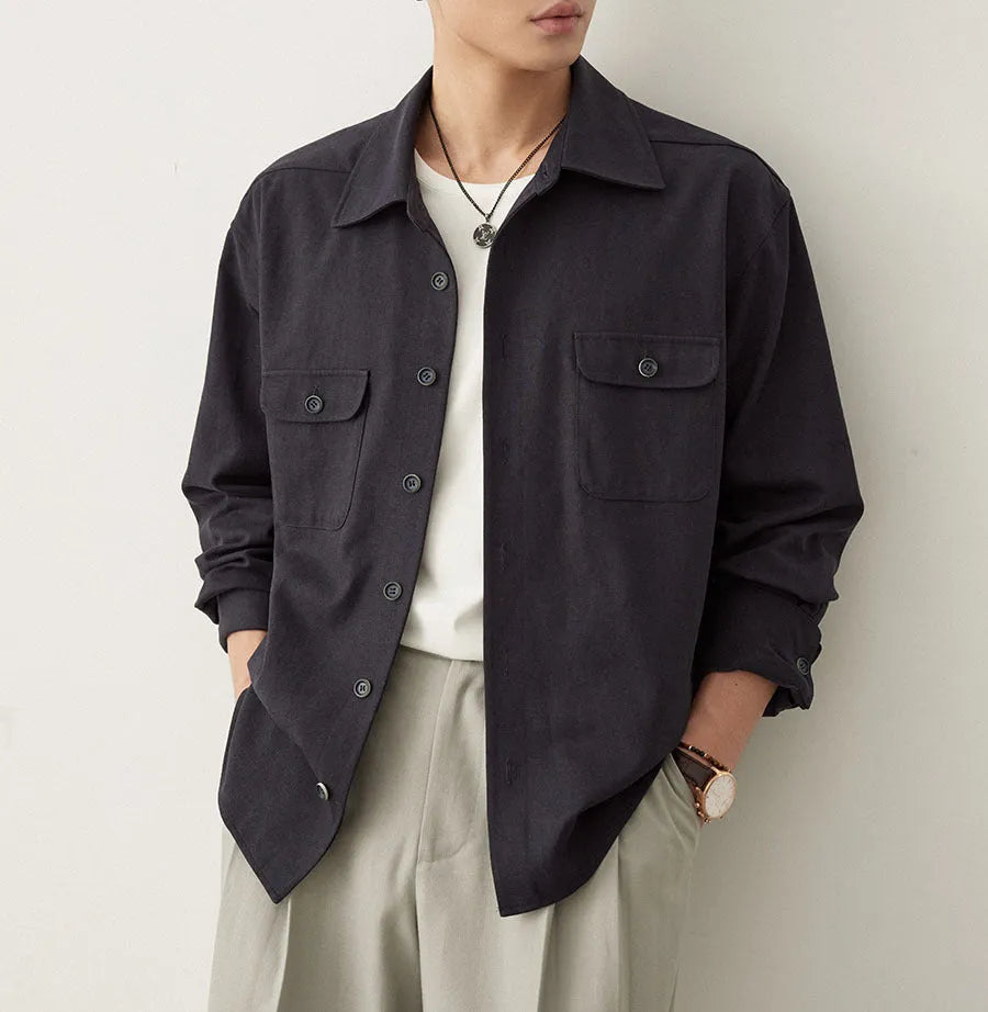Men's simple profile lapel shirt in light sand rice colour, showing long sleeves and front button placket.