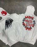 Black loose hooded sweatshirt with printed skull and rhinestone lettering on front